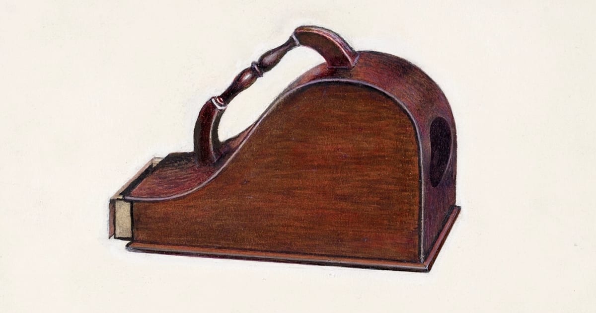 An old wooden ballot box with a carrying handle